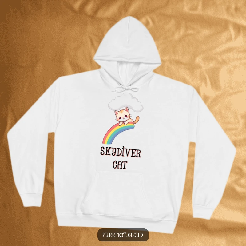Funny hoodie with a cat gleefully sliding down a vibrant rainbow that descends from a soft, fluffy cloud.