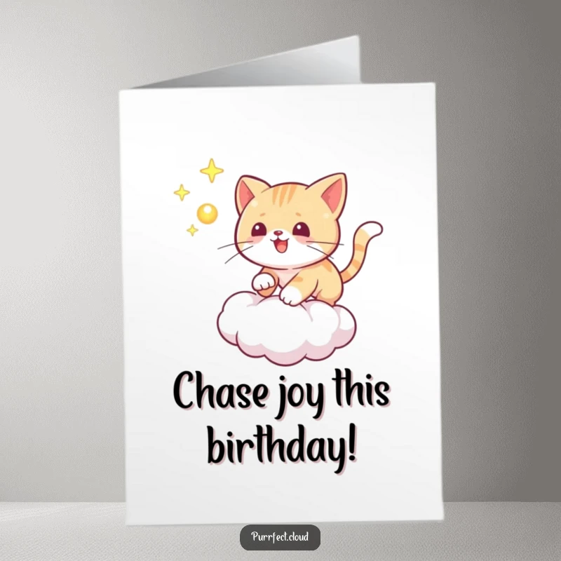Funny Free Printable Birthday Card: a playful cat chases a glowing orb across a mystical cloud.