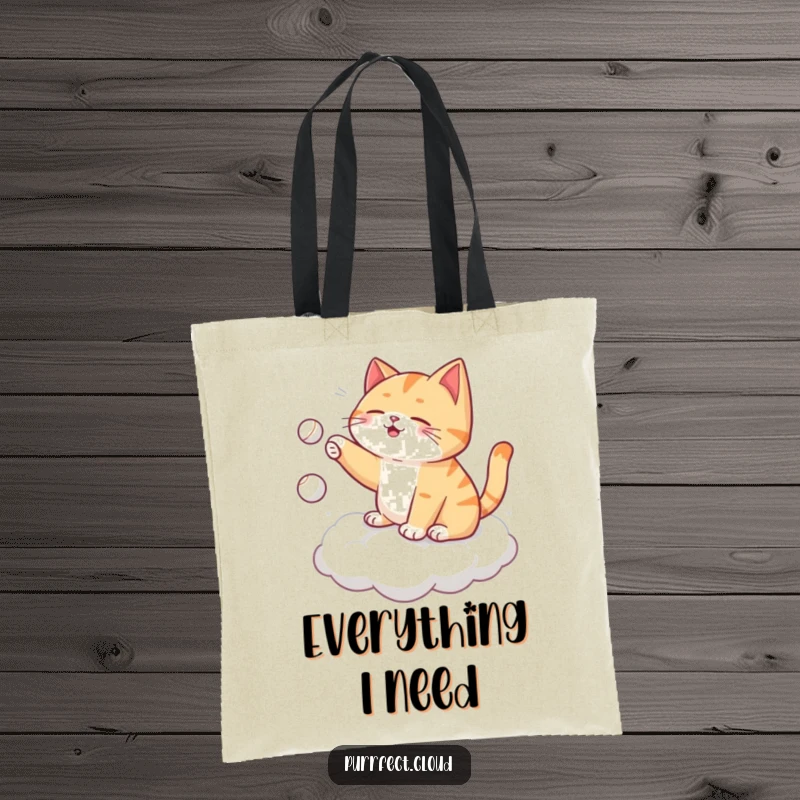 Funny cat tote bag, playing fetch with itself on a cloud, tossing a tiny ball, ideal for carrying items with humor.