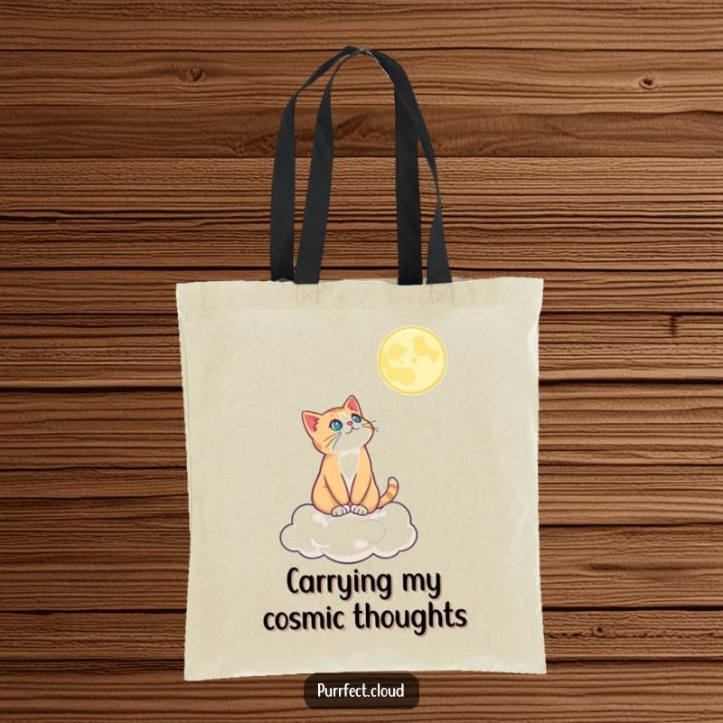 Funny tote bag showing a cat on a cloud looking up at the moon, perfect for carrying everyday items with a touch of magic.