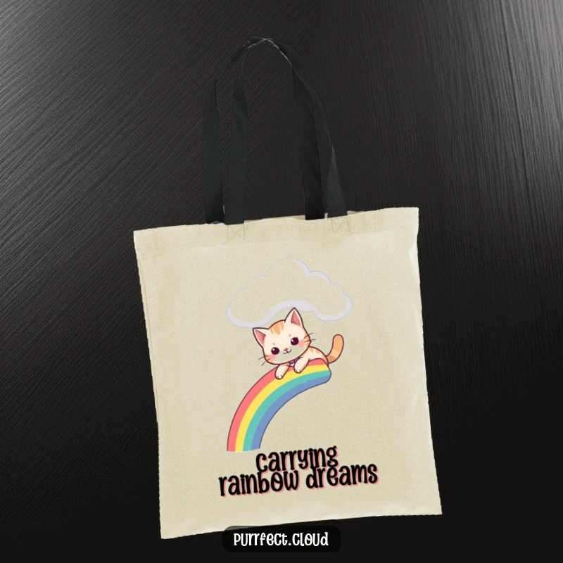 Funny tote bag depicting a cat sliding down a colorful rainbow that starts from a charming cloud.